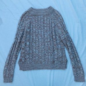 Tan knit sweater.